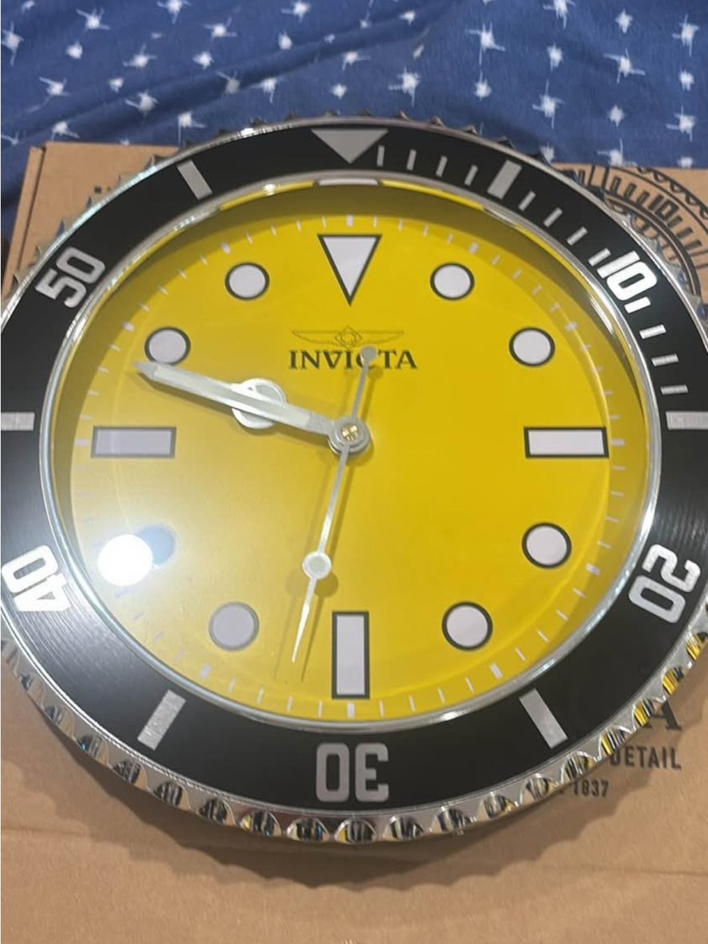 Invicta Yellow Dial Wall Clock with Black Bezel